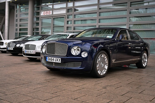 Frankfurt, Germany - September, 16th, 2015: The Bentley limousines stopped on the parking on the motor show. These vehicles are the ones of the most expensive cars in the world.