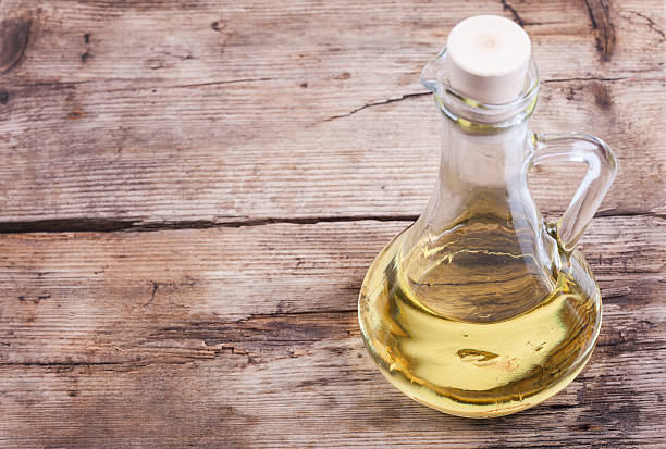 istock background cooking oil in bottle on wooden rustic table 511380978