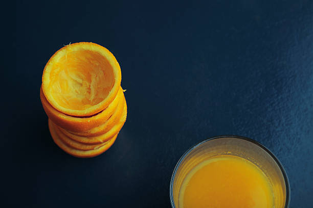 istock citrus peels and juice glass isolated top view 511381040