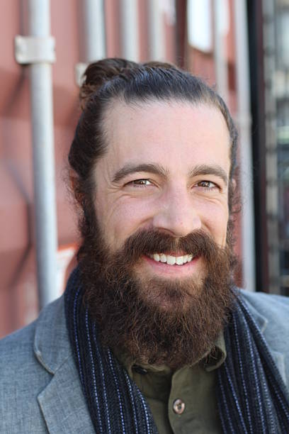 istock portrait of laughing sexy man with long beard 511382392