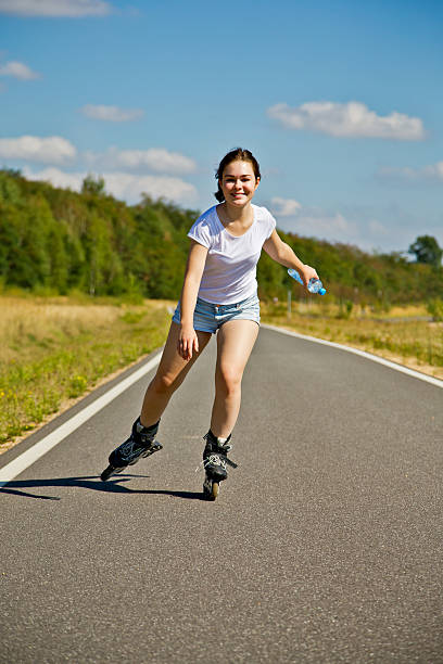 istock Young woman rollerblading outdoor 511383158