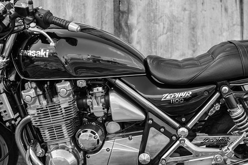 Subotica, Serbia - February 20th, 2016: Photo shoot of Kawasaki ZR 1100 Zephyr A1 bike from 1992, close up shoot of reservoir, engine cylinders and driver seat outdoors in front of the old garage.Four stroke transverse four cylinder. DOHC, 2 valves per cylinder. 1062cc, air cooled