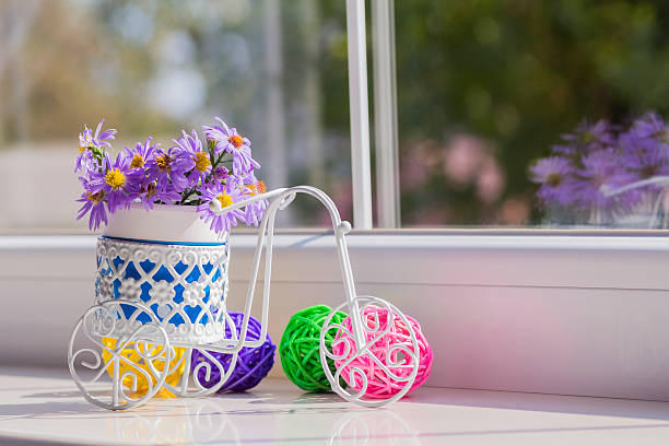 istock Bunch of small purple chrysanthemums in white vintage bicycle 511384640