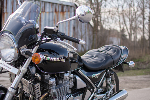 Subotica, Serbia - February 20th, 2016: Photo shoot of Kawasaki ZR 1100 Zephyr A1 bike from 1992, close up shoot of bike from the left side, outdoors in front of the old garage.Photo was taken in front of the motorcycle. Selective focus on reservoir sign.