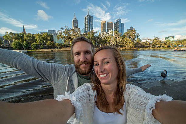 istock Young couple in Melbourne take selfie portrait along Yarra River 511385562
