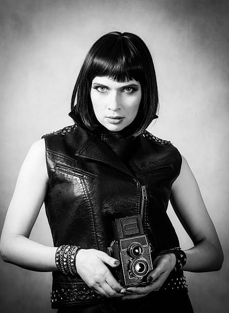 istock Girl with a twin-lens reflex camera 511385704
