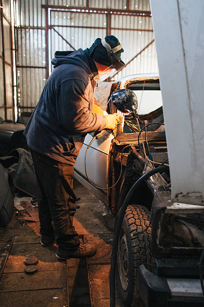 istock Mechanic repair and service car in garage 511386028