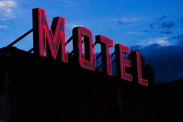 Vintage Neon Motel Sign in Colorad Mountain Landscape