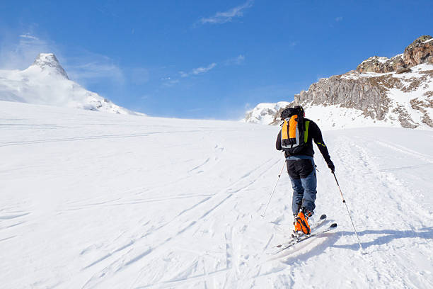 istock skier going up of a mountain 511387834