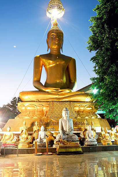 istock Statue of Buddha in a temple Mani Phraison 511389014