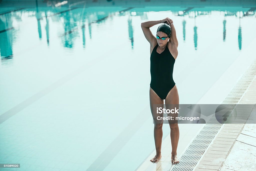 Swimmer at the poolside Swimmer at the poolside, warming up Active Lifestyle Stock Photo