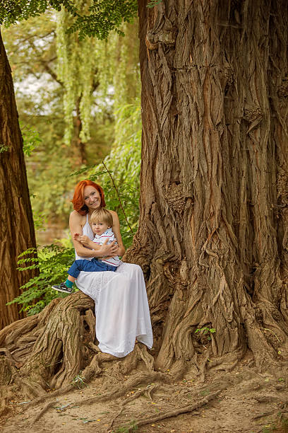 istock Caucasian baby boy take rest in summer park 511389068