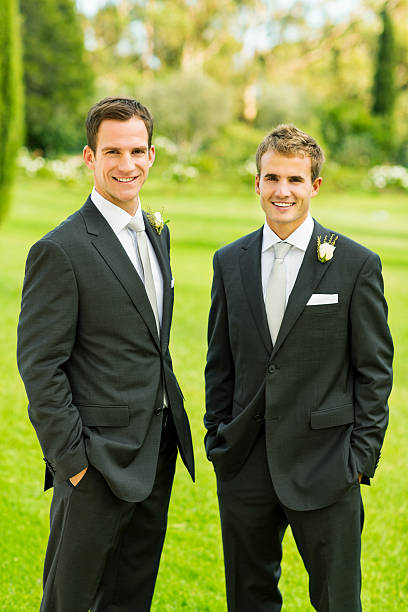 istock Groom And Best Man Standing Together In Garden 511390241