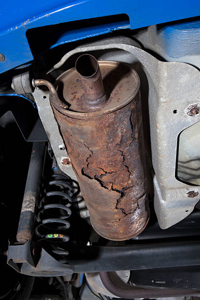 istock Auto repair shop, rusted exhaust pipe 511390263