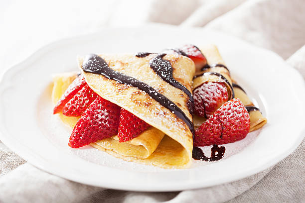 pancakes with strawberry and chocolate sauce stock photo