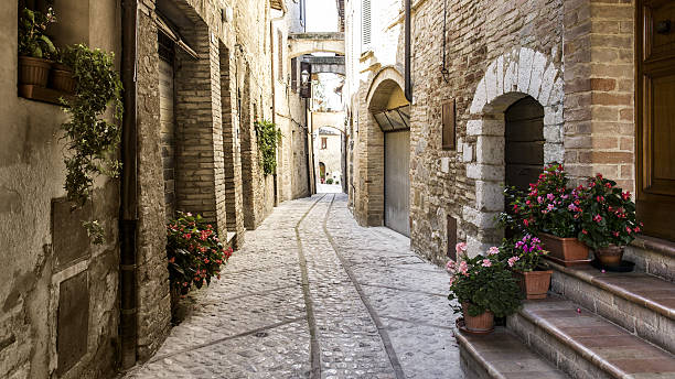 typical medieval street in italy - spoleto bildbanksfoton och bilder