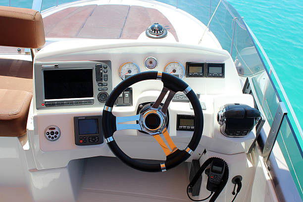 control panel and helm on motor yacht stock photo