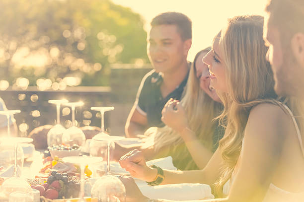 istock Group of young people eating outdoors. 511391808