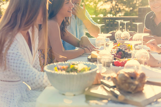 istock Group of young people eating outdoors. 511391878
