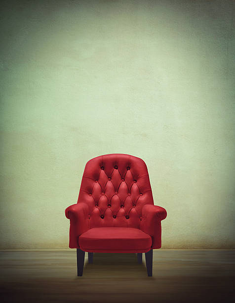 The hot seat... Shot of a solitary red leather chair legs against the wall stock pictures, royalty-free photos & images