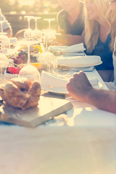 istock Group of young people eating outdoors. 511392284