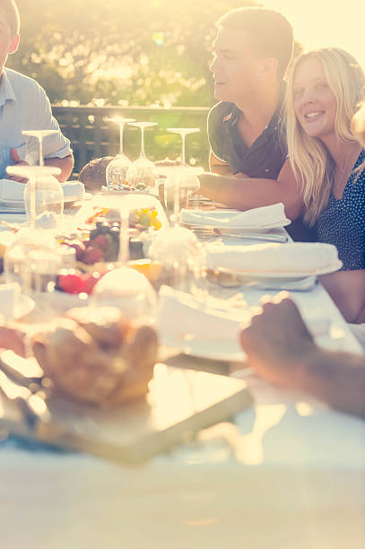 istock Group of young people eating outdoors. 511392374