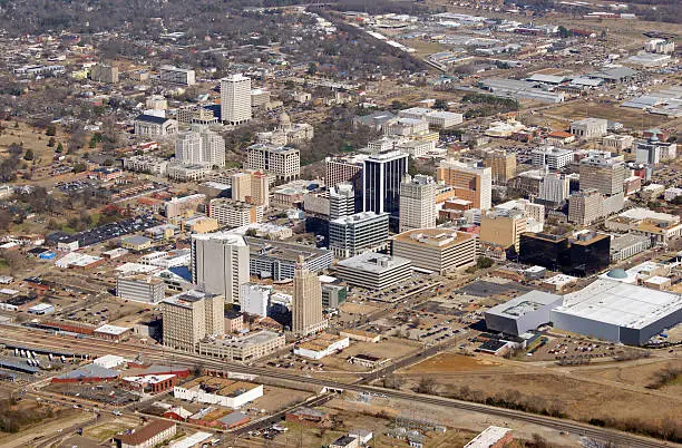This 2014 photo was taken from a Robinson 44 helicopter with the door removed. Jackson is the capital of and the largest city in the U.S. state of Mississippi. It is located primarily in Hinds County. Jackson is on the Pearl River, which drains into the Gulf of Mexico, and it is part of the Jackson Prairie region of the state. The city is named after General Andrew Jackson, who was honored for his role in the Battle of New Orleans during the War of 1812 and later served as U.S. President. The current slogan for the city is "Jackson, Mississippi: City with Soul." It has had numerous musicians prominent in blues, gospel and jazz.