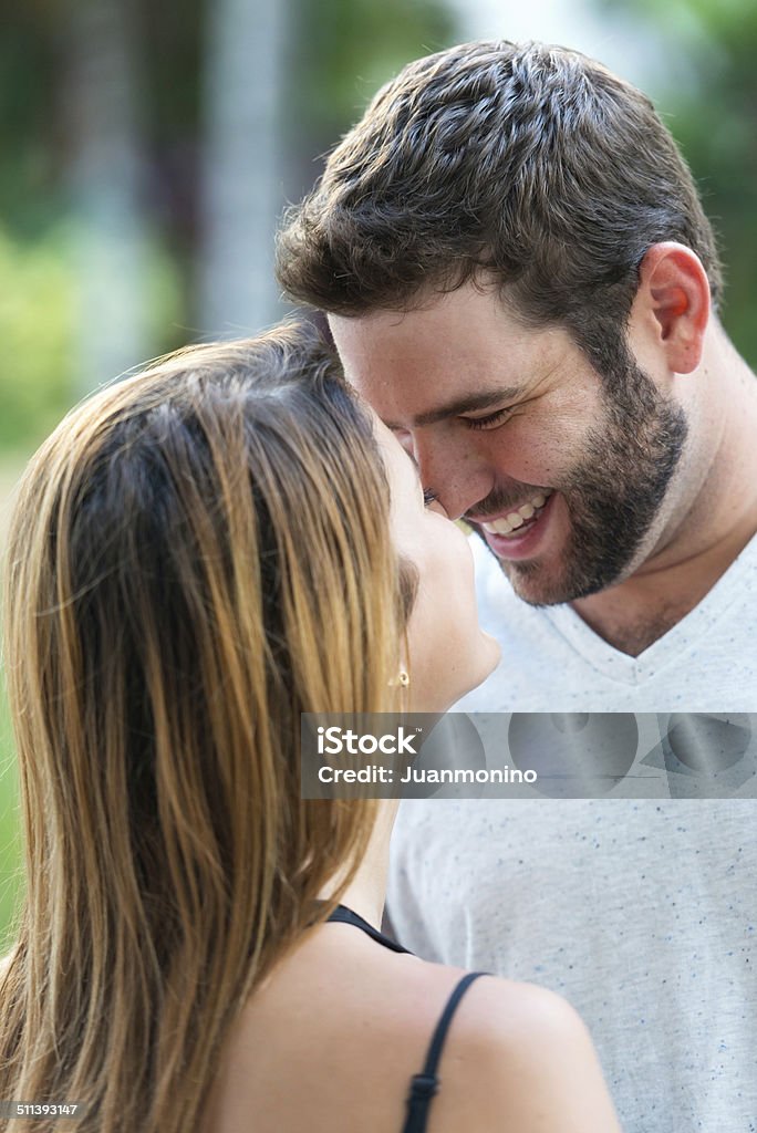 Young couple Smiling young couple posing together laughing looking to each other 20-24 Years Stock Photo