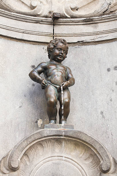 Manneken Pis bronze sculpture in Brussels, Belgium Manneken Pis bronze sculpture in Brussels, Belgium manneken pis statue in brussels belgium stock pictures, royalty-free photos & images