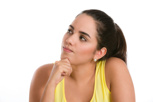 Hispanic young woman thinking of the options. Image isolated on white with clipping path.