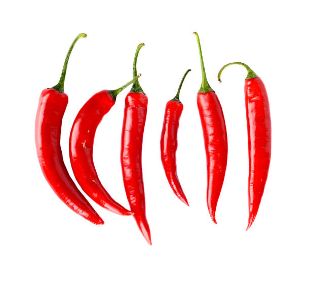 istock Top view of red peppers isolated white background 511437081