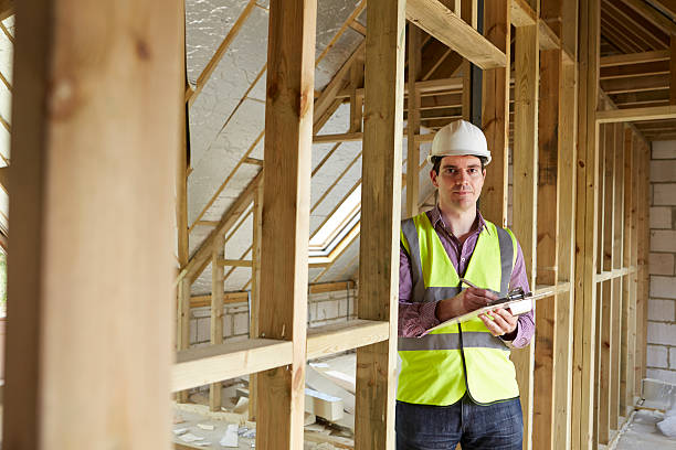 istock Building Inspector Looking At New Property 511439577