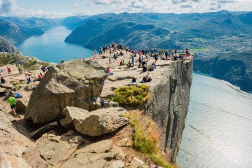 Many people on Preikestolen , Pulpit Rock 608m above Lysefjorden in Norway.