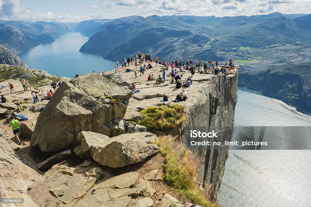 Pulpit Rock and Lysefjorden Many people on Preikestolen , Pulpit Rock 608m above Lysefjorden in Norway. Preikestolen - Norway Stock Photo