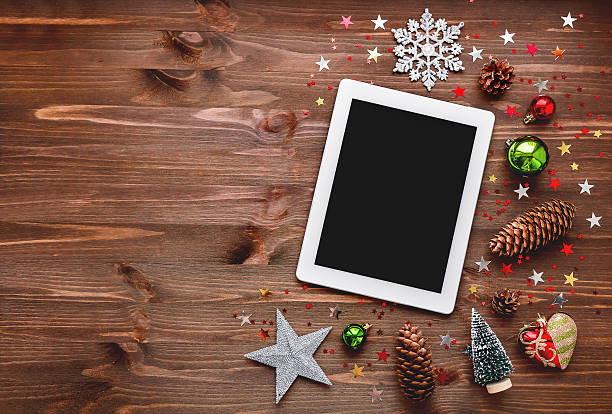 istock Christmas and New year background with tablet and decorations. 511456876