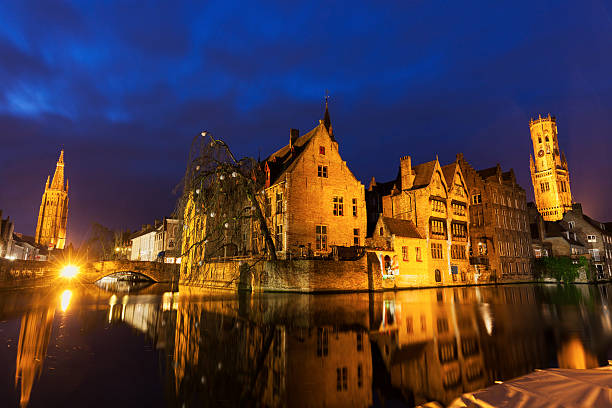 istock Belfry of Bruges reflected in the canal 511457374