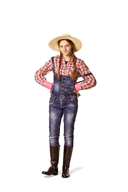 istock Waiting young woman with hat, dungarees and wellingtons. 511458740