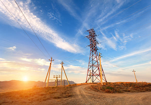 istock High voltage tower in mountains at sunset. Electricity pylon system 511459092
