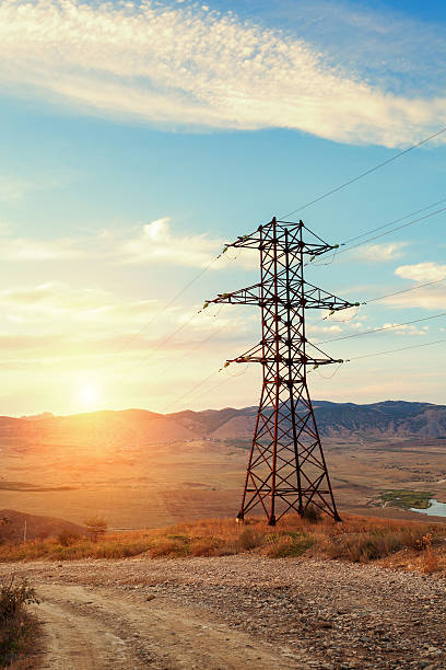 istock High voltage tower in mountains at sunset. Electricity pylon system 511459144