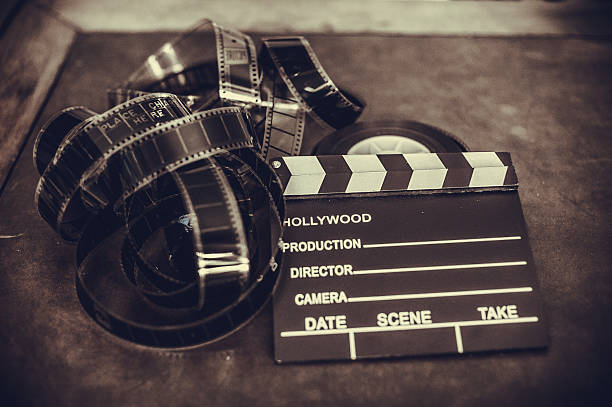 istock Movie clapper board and filmstrip selective focus 511459760