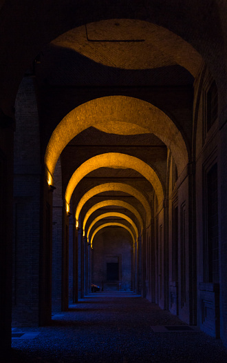 The arcade of 16th century Palazzo della Pilotta in Parma, Italy at night