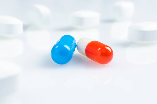 istock White, blue and red medicine antibiotic pills 511460138