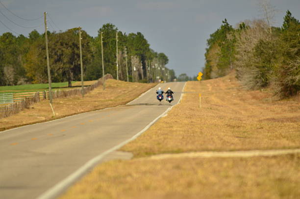 istock Two motorcycles with heat haze on rural road 511460760