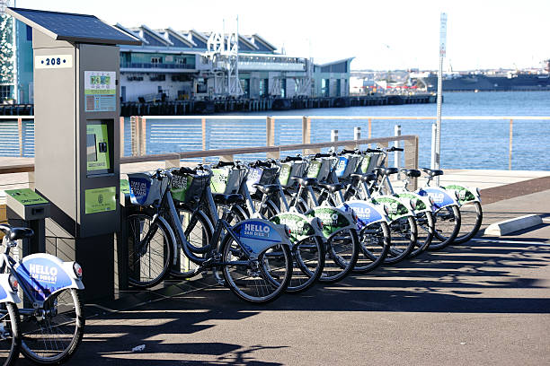 Bicycle Rental San Diego San Diego, United States - December 25, 2015: Bicycles of the bicycle rental Decobike stand behind each other at a solar paneled docking station on December 25, 2015 at the Port of San Diego.    parallel port stock pictures, royalty-free photos & images