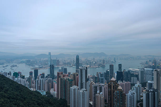 istock Hong Kong Skyline Harbour Illuminated at Twilight Vertical 511461074