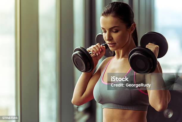 Woman In Gym Stock Photo - Download Image Now - Women, Dumbbell, Exercising