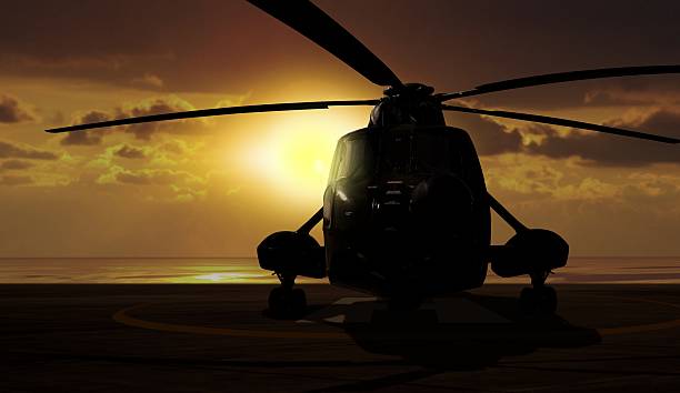istock Military helicopter on carrier ship at sunset 511462626