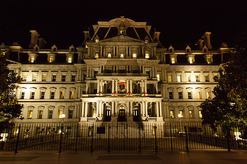 Washington DC, United States - December 5, 2015: A view of the Eisenhower Executirve Office Building at night, decorated for Christmas
