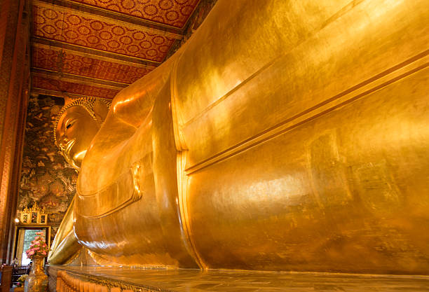 istock Reclining Buddha gold statue. Wat Pho, Bangkok, Thailand 511465654