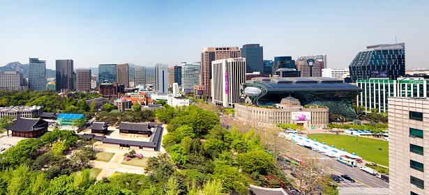 Seoul panoramic skyline daytime featuring City Hall and Deoksugung Palace.